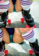A close up of a person on roller skates on the ground.